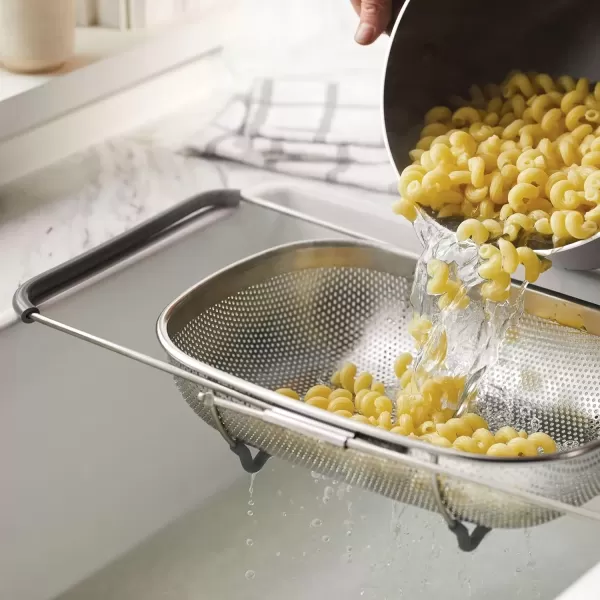 imageRachael Ray Tools and Gadgets OverTheSink ColanderStrainer for Pasta Fruits Veggies Expandable Silicone Grips Dishwasher Safe 45 Quart Stainless Steel with Gray HandlesStainless Steel with Gray Handles