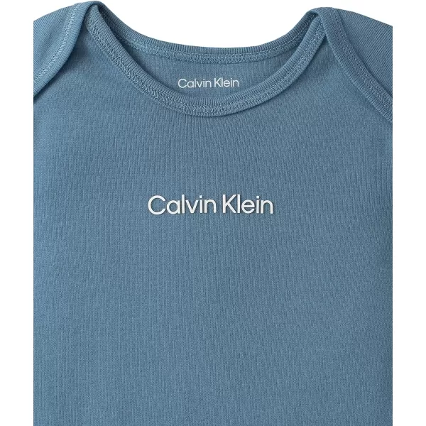 Calvin Klein babyboys 4piece Set With Long Sleeve Tee amp Pants Ultrasoft Beanie amp Socks IncludedCoronet Blue