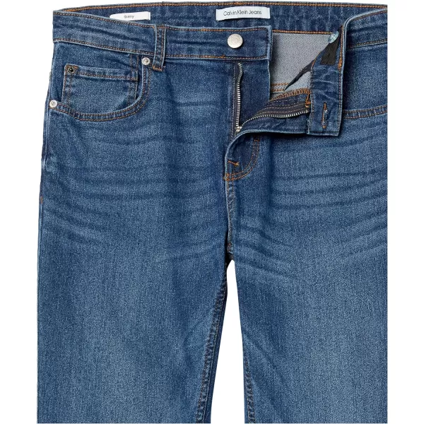 Calvin Klein Boys Skinny Fit Stretch Denim Jeans 5Pocket Style amp Zipper ClosureHouston Mid Blue 15b