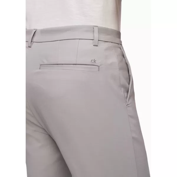 Calvin Klein Mens Modern Stretch Wrinkle Resistant Chino Pants in Slim FitAlloy