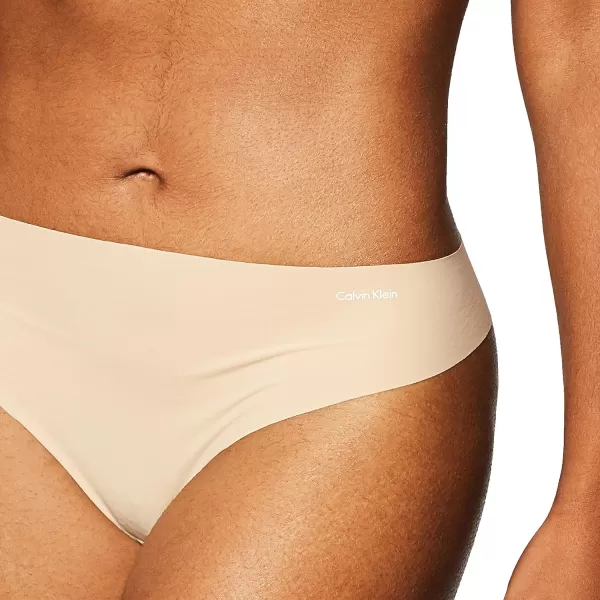 Calvin Klein Womens Invisibles Seamless Thong PantyLight Caramel