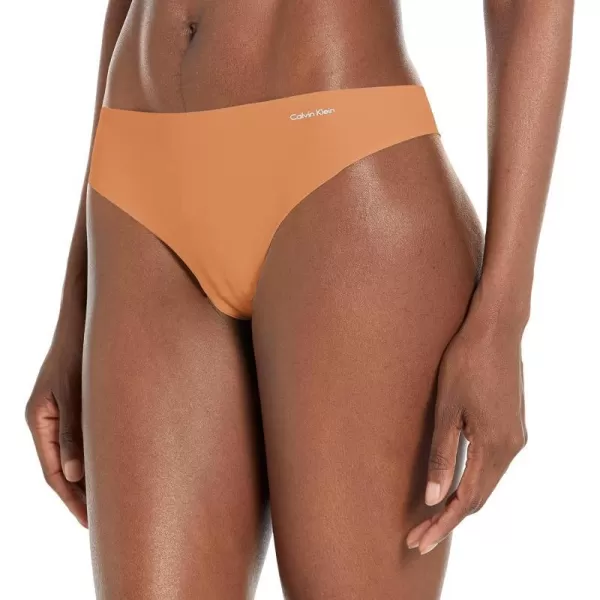 Calvin Klein Womens Invisibles Seamless Thong PantyBronzed