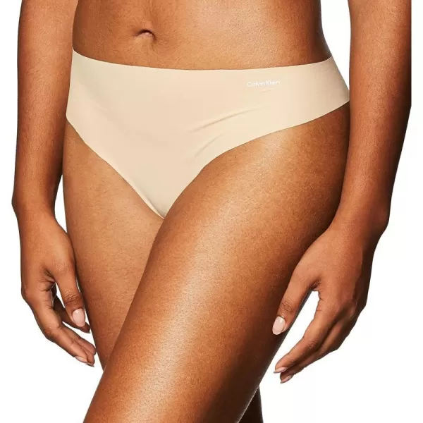 Calvin Klein Womens Invisibles Seamless Thong PantyLight Caramel