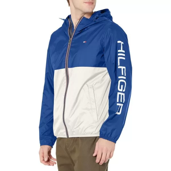 Tommy Hilfiger Mens Lightweight Active Water Resistant Hooded Rain JacketRoyal BlueIce Colorblock