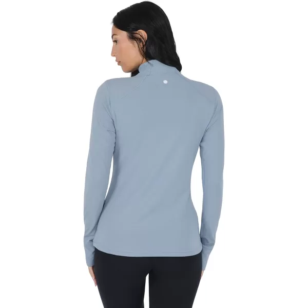 Yogalicious Nude Tech Half Zip Long Sleeve Jacket with Front PocketsTradewinds